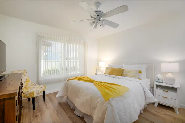 a bedroom with a bed and a table