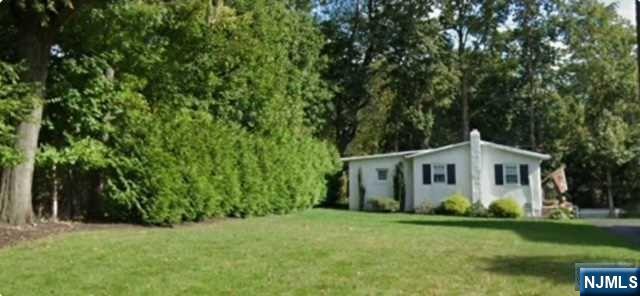 295 Lincoln Avenue Ridgewood, NJ 07450 - Photo 2 of 17 a view of a house with backyard and garden