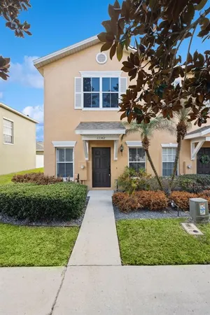 a front view of a house with a yard