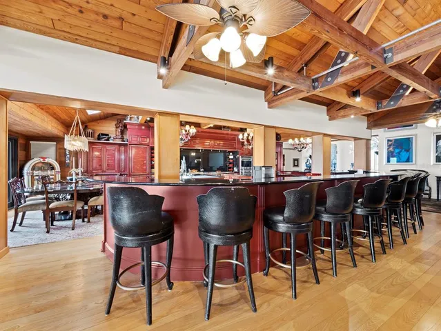 a view of a kitchen with a large counter top and couches