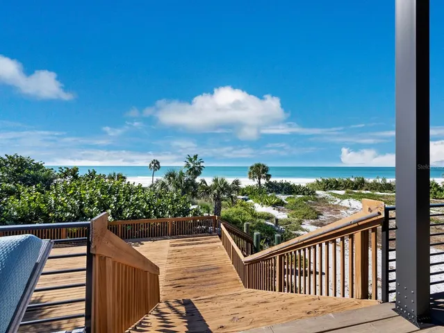 a bedroom with furniture a bed and a chandelier