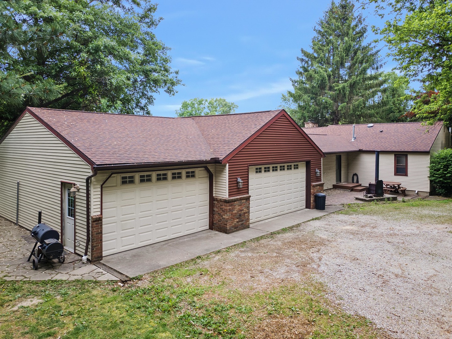 7308 West Lancaster Road Peoria, IL 61607 - Photo 1 of 55 a view of a house with a yard and sitting area