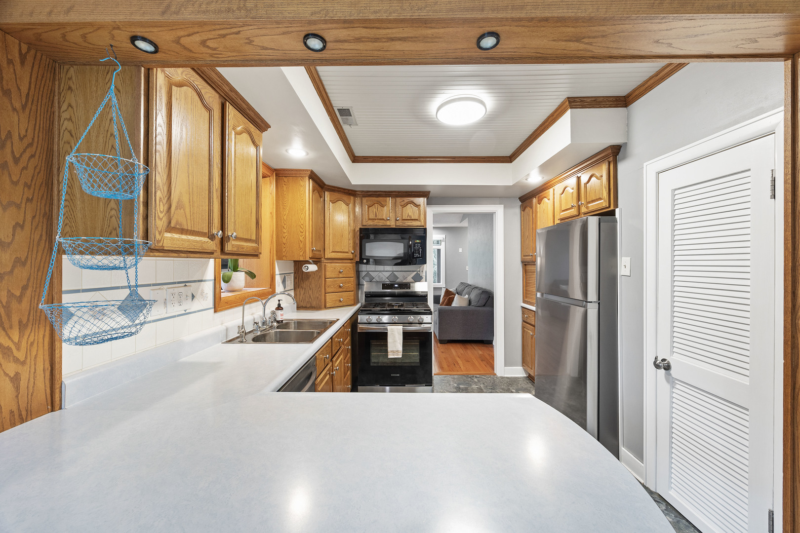 7308 West Lancaster Road Peoria, IL 61607 - Photo 11 of 55 a kitchen with stainless steel appliances a refrigerator and a stove