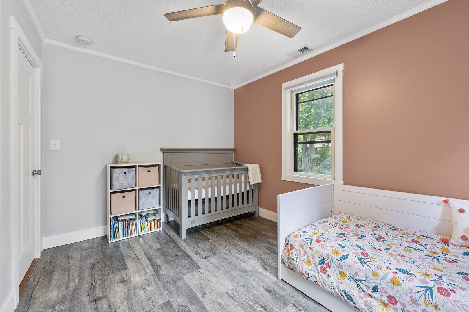 7308 West Lancaster Road Peoria, IL 61607 - Photo 24 of 55 a bedroom with a bed and a book shelf