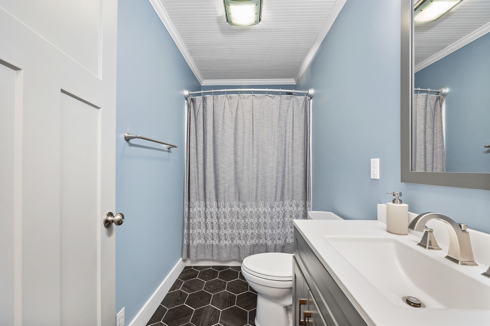 7308 West Lancaster Road Peoria, IL 61607 - Photo 26 of 55 a bathroom with a sink toilet and shower