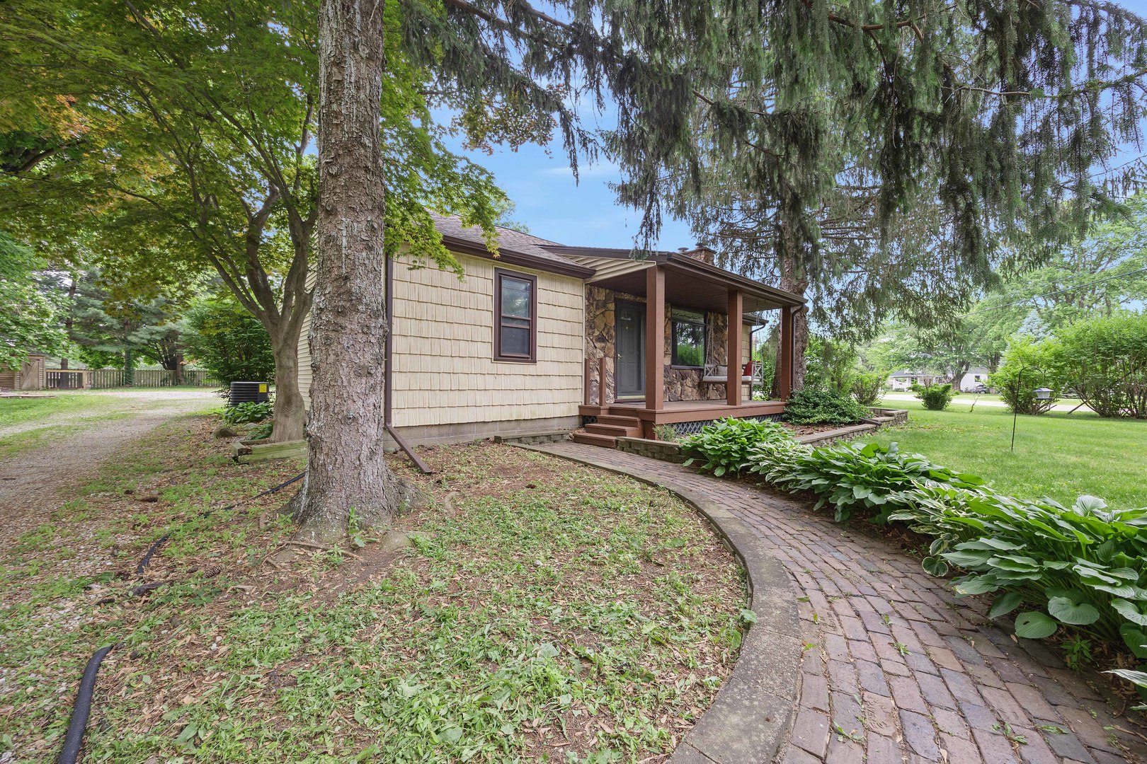 7308 West Lancaster Road Peoria, IL 61607 - Photo 47 of 55 a front view of a house with a yard