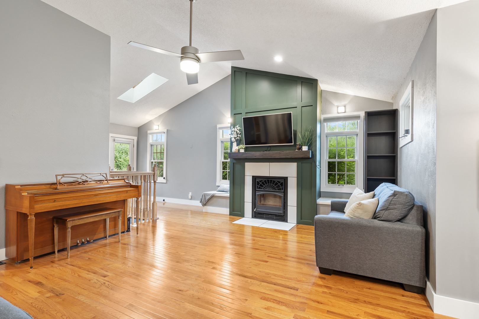 7308 West Lancaster Road Peoria, IL 61607 - Photo 5 of 55 a living room with furniture a fireplace and a flat screen tv