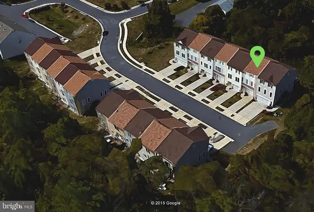 an aerial view of a house swimming pool and outdoor space