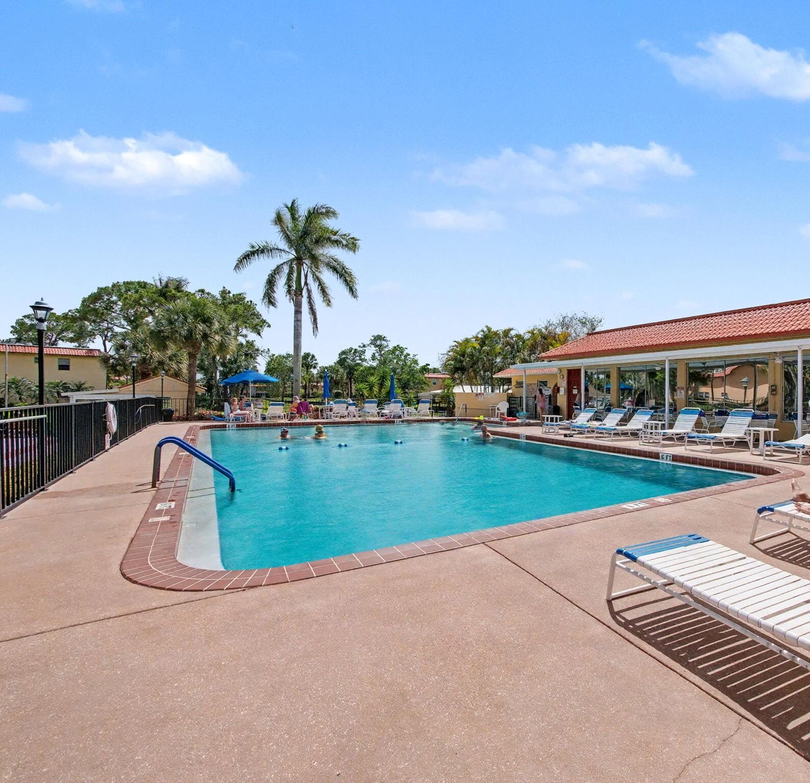 1967 Southwest Palm City Road, Unit 34C Stuart, FL 34994 - Photo 19 of 25 a view of swimming pool with outdoor seating and yard in back