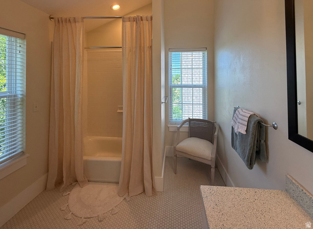 776 Canyon Road Hyde Park, UT 84318 - Photo 35 of 57 Bathroom featuring a tub/shower combination with tile surround, a window with horizontal blinds, and mosaic tile flooring