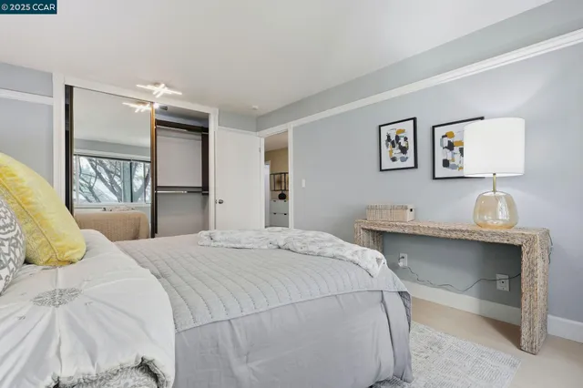 a bedroom with a bed and a desk