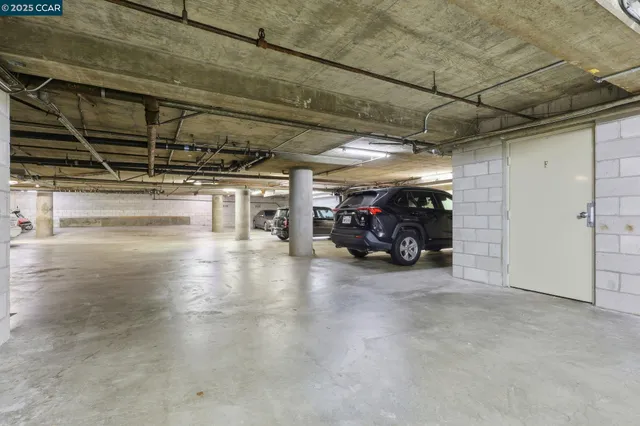 a view of a garage with parked cars