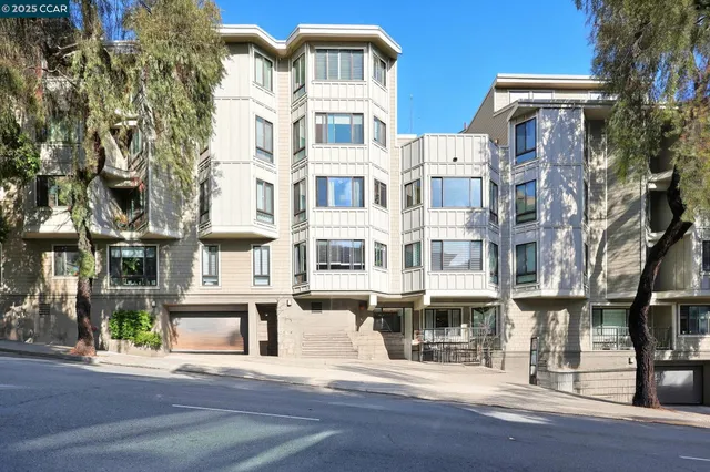 a front view of residential houses with street