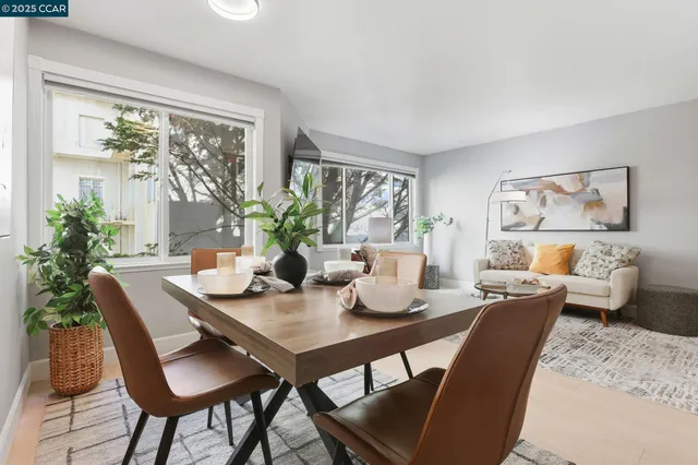 a view of a dining room with furniture window and outside view