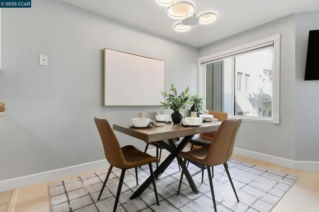 a view of a dining room with furniture and window