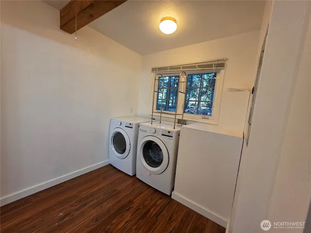 a bathroom with a toilet a sink and a mirror
