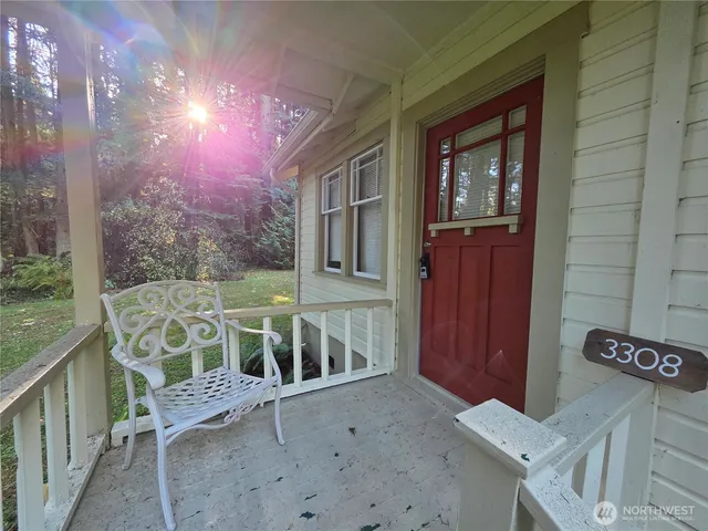 a view of two chairs in the balcony