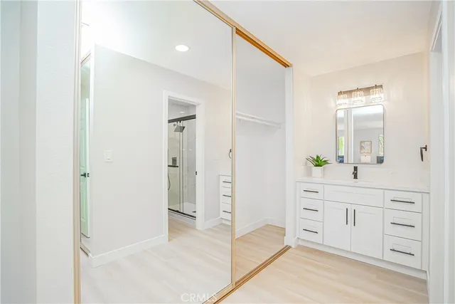 a spacious bathroom with a shower and a sink