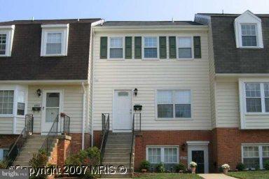 1681 Ridgely Court, Unit 185 Crofton, MD 21114 - Photo 1 of 1 a view of a building with many windows