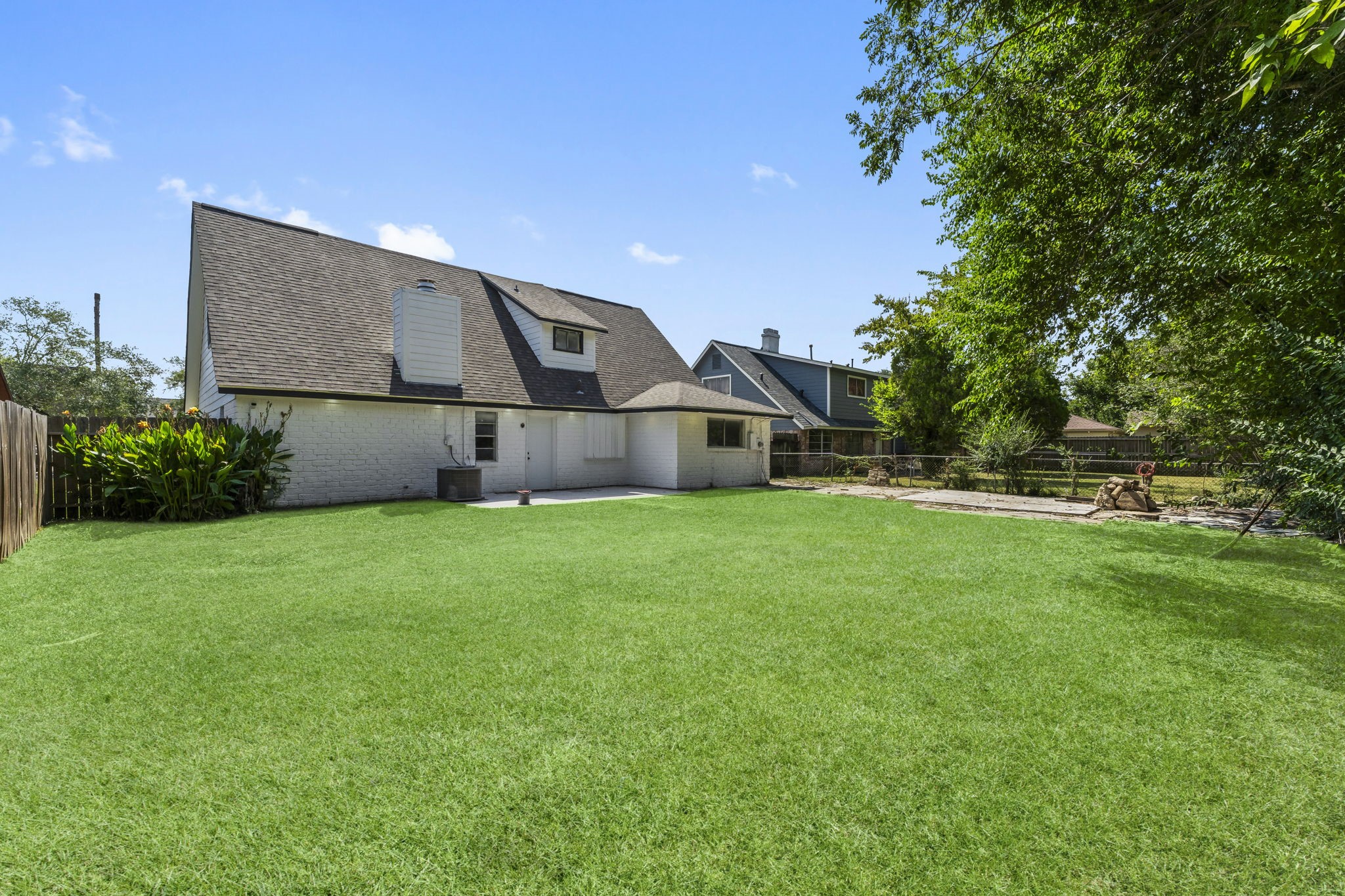 6918 Thornwild Road Houston, TX 77489 - Photo 20 of 21 a front view of a house with a yard and trees