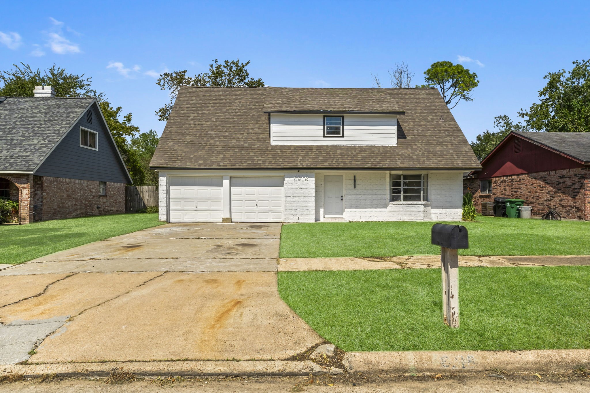 6918 Thornwild Road Houston, TX 77489 - Photo 2 of 21 a front view of a house with a garden and yard