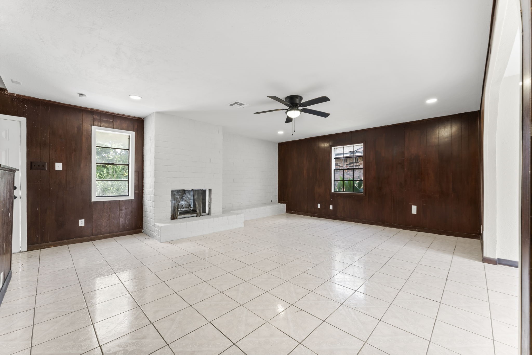 6918 Thornwild Road Houston, TX 77489 - Photo 5 of 21 a view of an empty room with a window and a kitchen