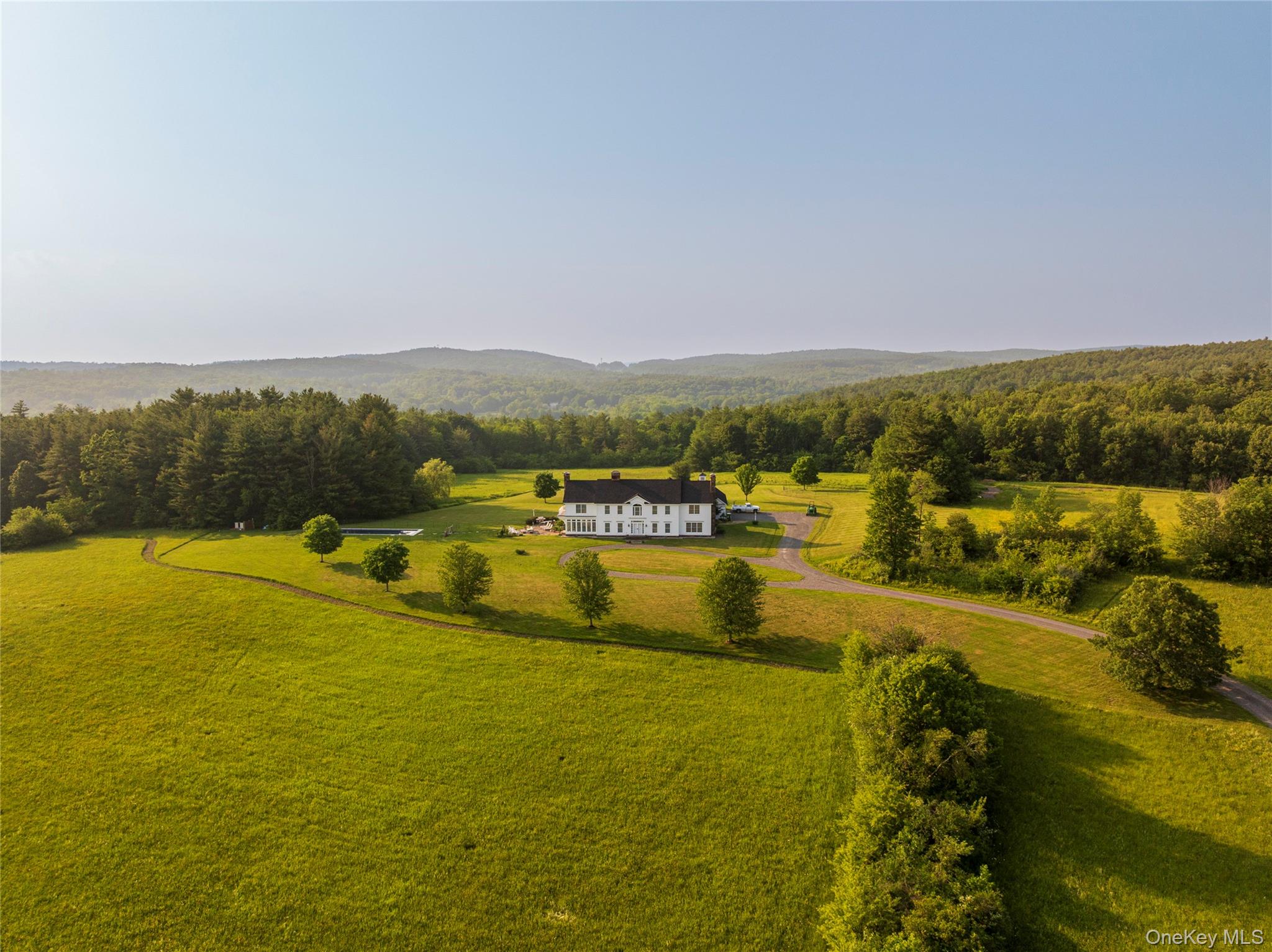 167 New Concord Road Chatham, NY 12060 - Photo 27 of 33 a view of a lake with houses