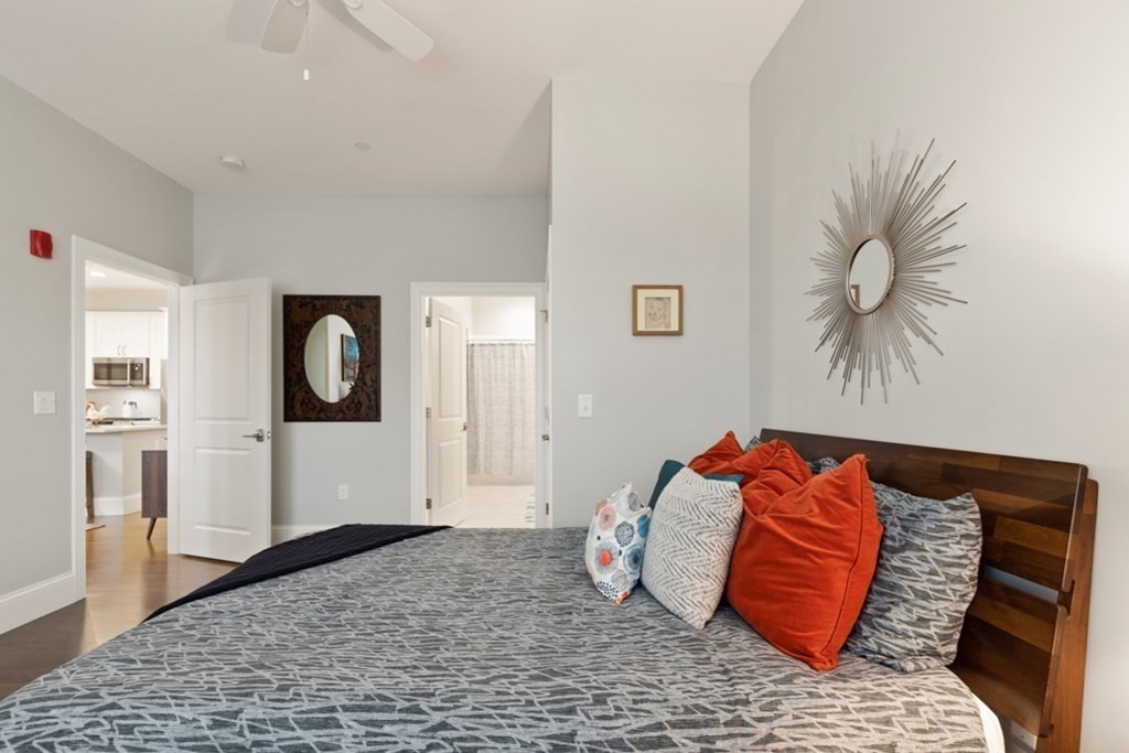 8 Sanborn Street, Unit 1009 Reading, MA 01867 - Photo 19 of 30 a bedroom with a bed and closet