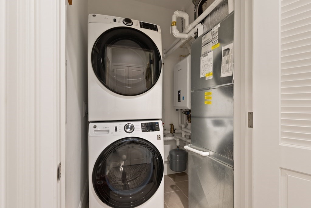 8 Sanborn Street, Unit 1009 Reading, MA 01867 - Photo 23 of 30 a close view of a utility room with dryer and washer