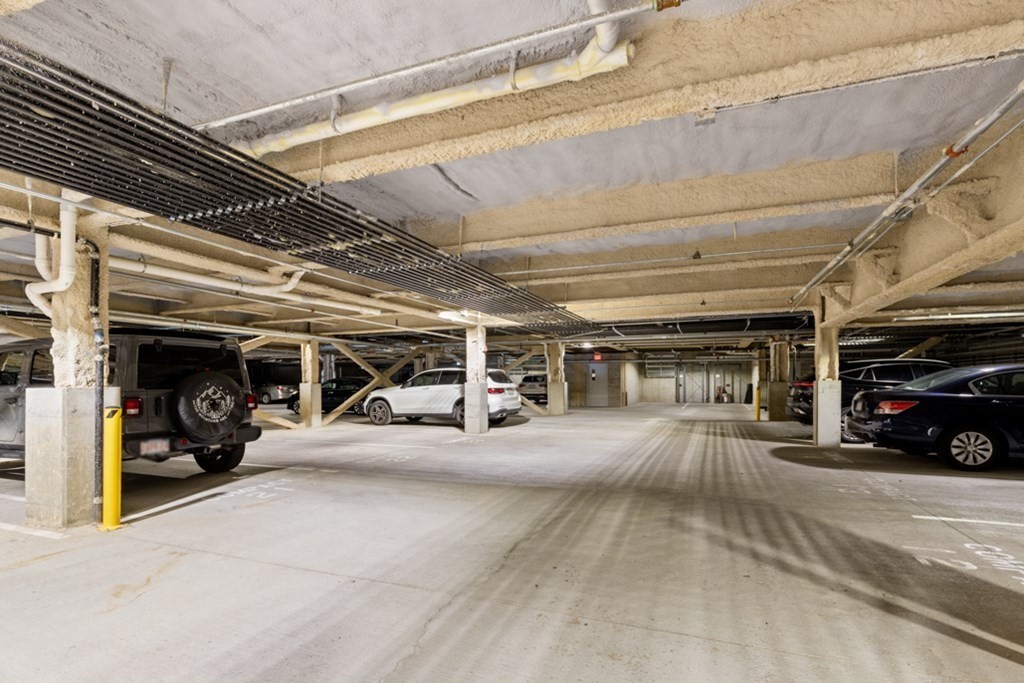 8 Sanborn Street, Unit 1009 Reading, MA 01867 - Photo 29 of 30 a view of parking garage with cars
