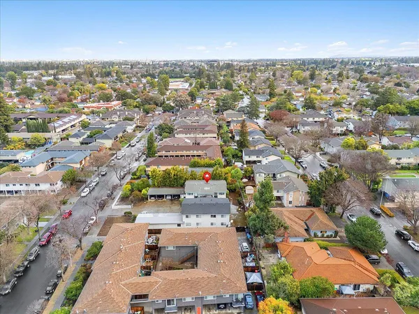 an aerial view of residential houses with outdoor space