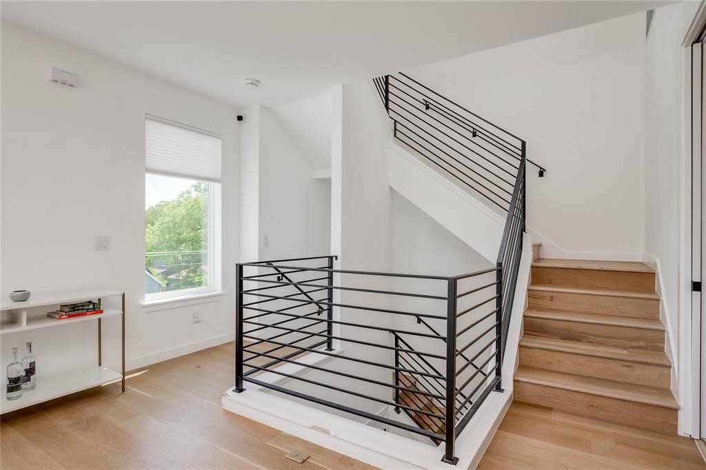 1208 Luna Street, Unit 1 Austin, TX 78721 - Photo 20 of 39 a view of a hallway with stairs and a window