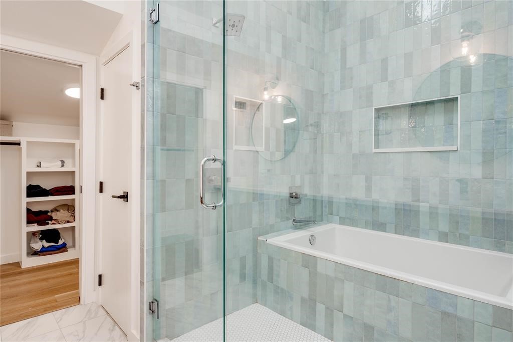 1208 Luna Street, Unit 1 Austin, TX 78721 - Photo 35 of 39 a bathroom with a bathtub and shower