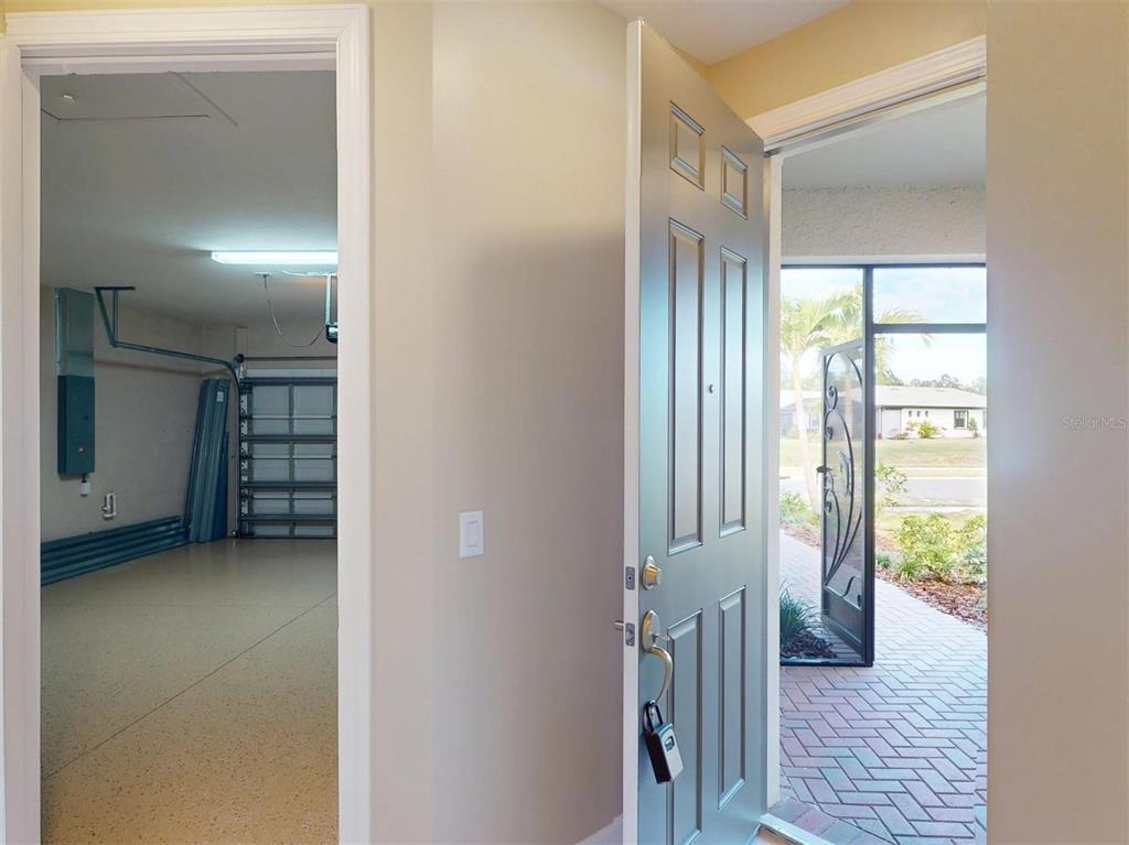 1352 Raspberry Dr Port North Port, FL 34289 - Photo 12 of 88 a view of a closet area with living room