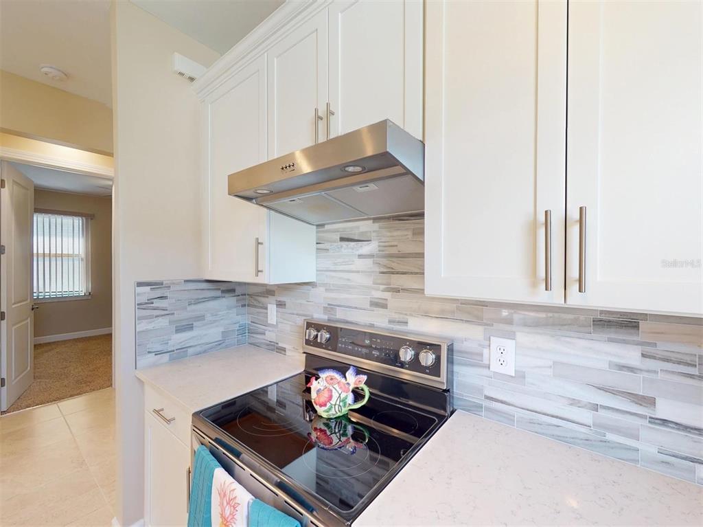 1352 Raspberry Dr Port North Port, FL 34289 - Photo 23 of 88 a kitchen with a stove and a sink