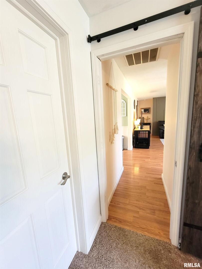16 Stone Forge Pike Flora, IL 62839 - Photo 43 of 98 a view of a hallway with wooden floor and a living room