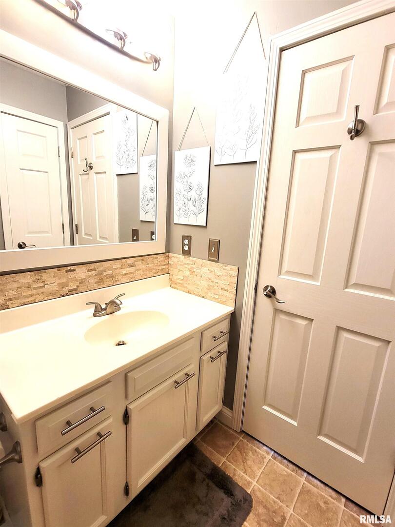 16 Stone Forge Pike Flora, IL 62839 - Photo 46 of 98 a view of a bathroom with a sink and a mirror