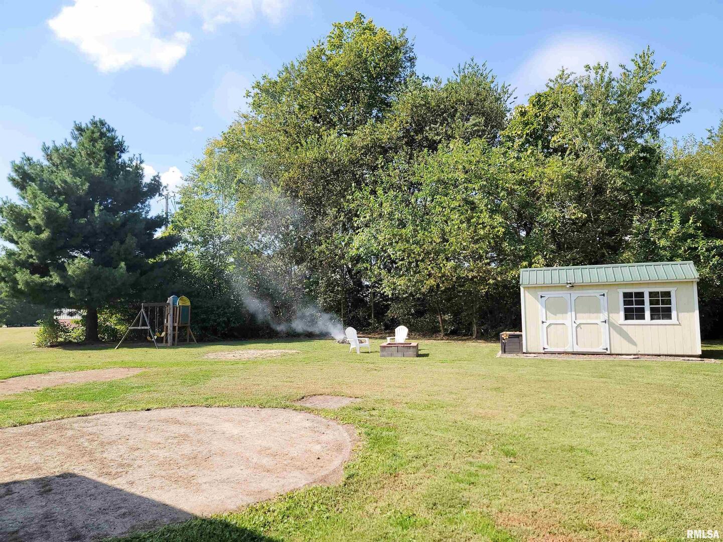 16 Stone Forge Pike Flora, IL 62839 - Photo 90 of 98 a view of a house with swimming pool and a yard