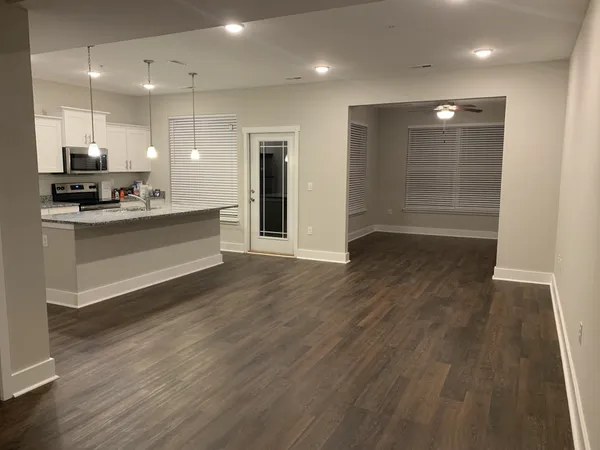 a view of kitchen with wooden floor
