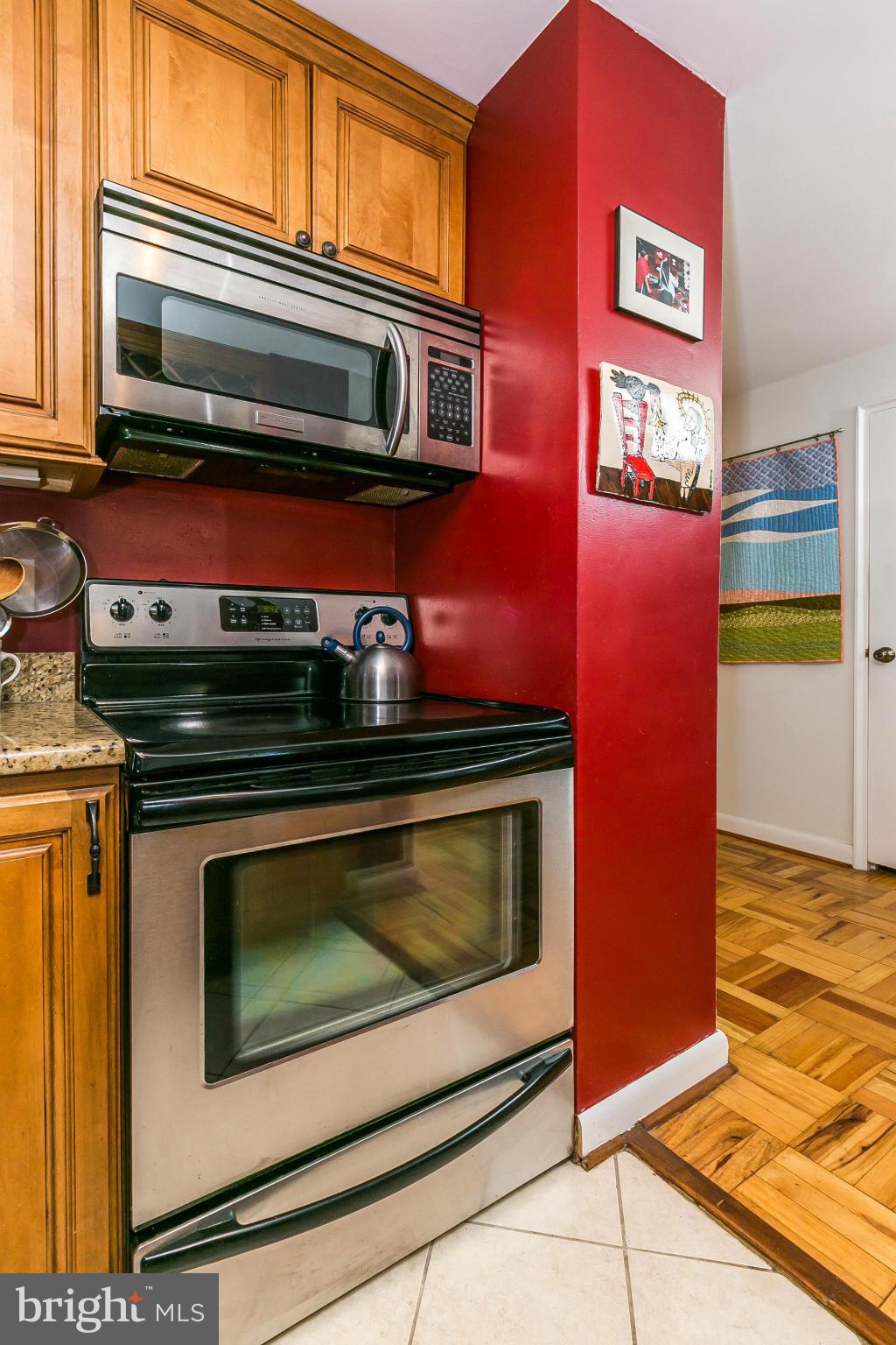 310 Ridgemede Road, Unit 107 Baltimore, MD 21210 - Photo 11 of 28 a stove top oven sitting inside of a kitchen