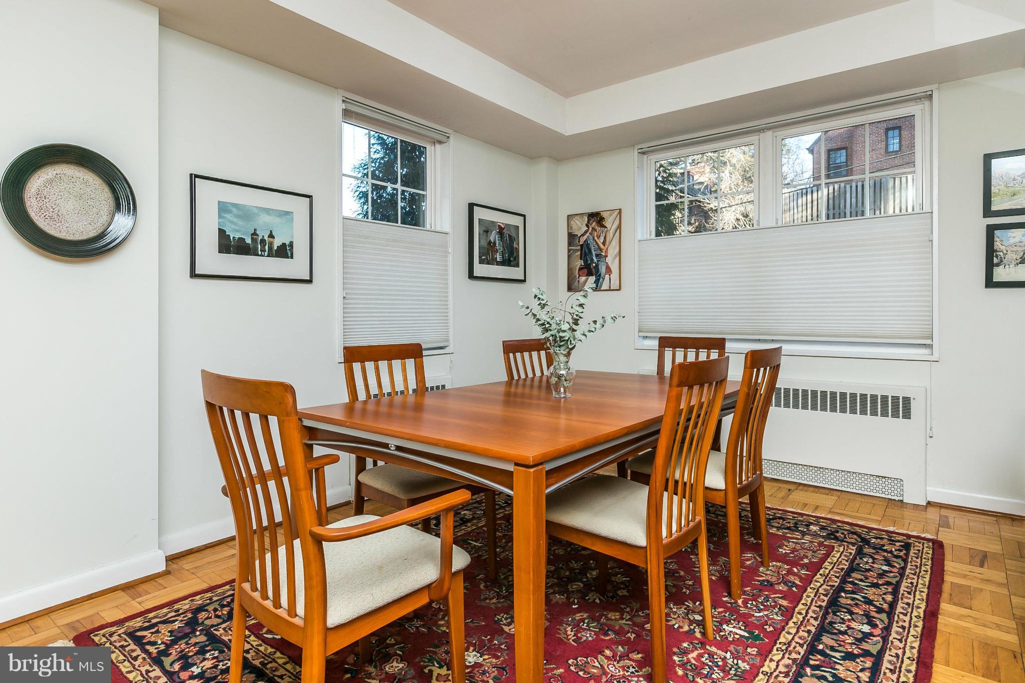 310 Ridgemede Road, Unit 107 Baltimore, MD 21210 - Photo 14 of 28 a view of a dining room with furniture