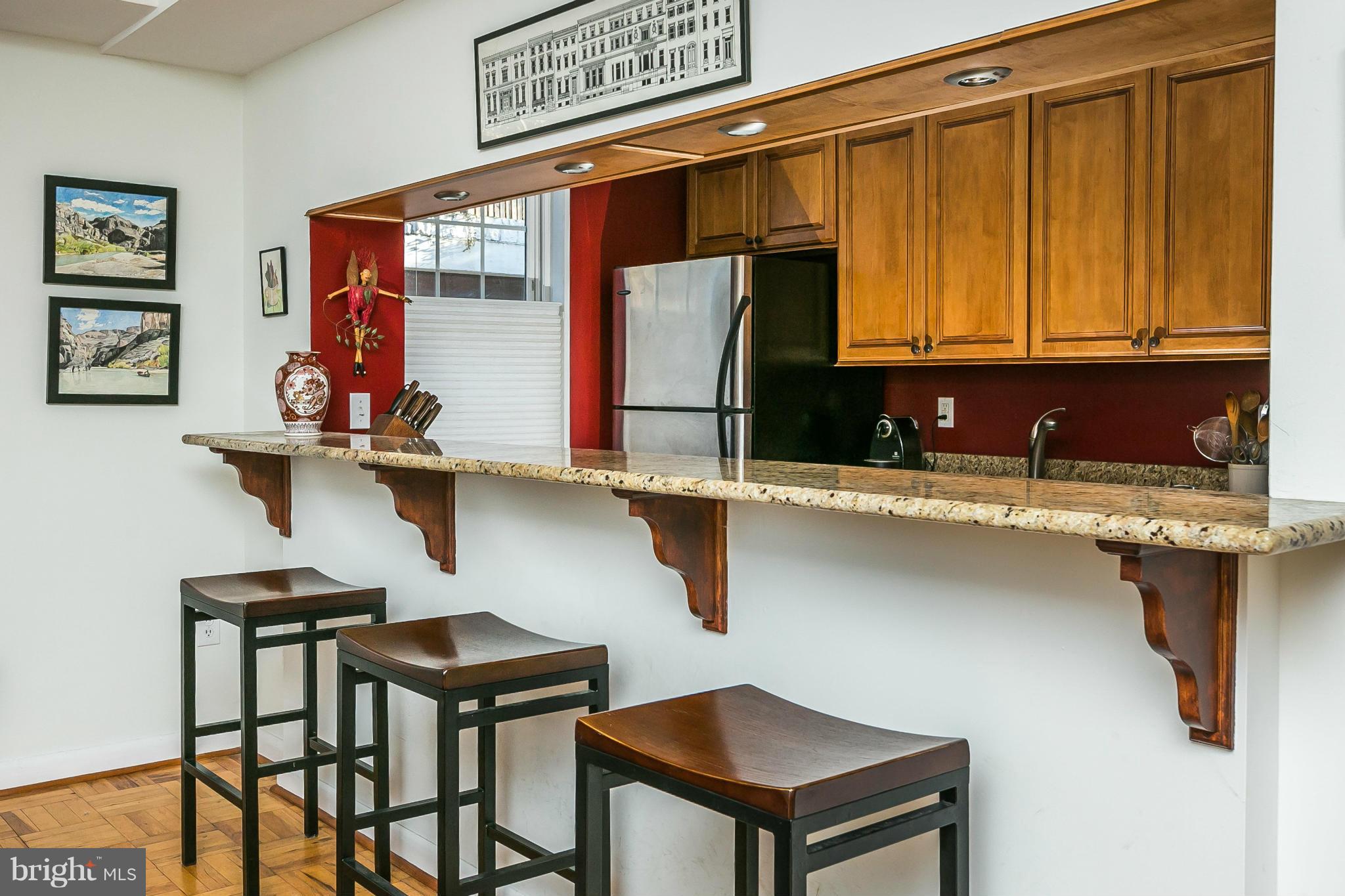 310 Ridgemede Road, Unit 107 Baltimore, MD 21210 - Photo 16 of 28 a kitchen with a sink cabinets and window