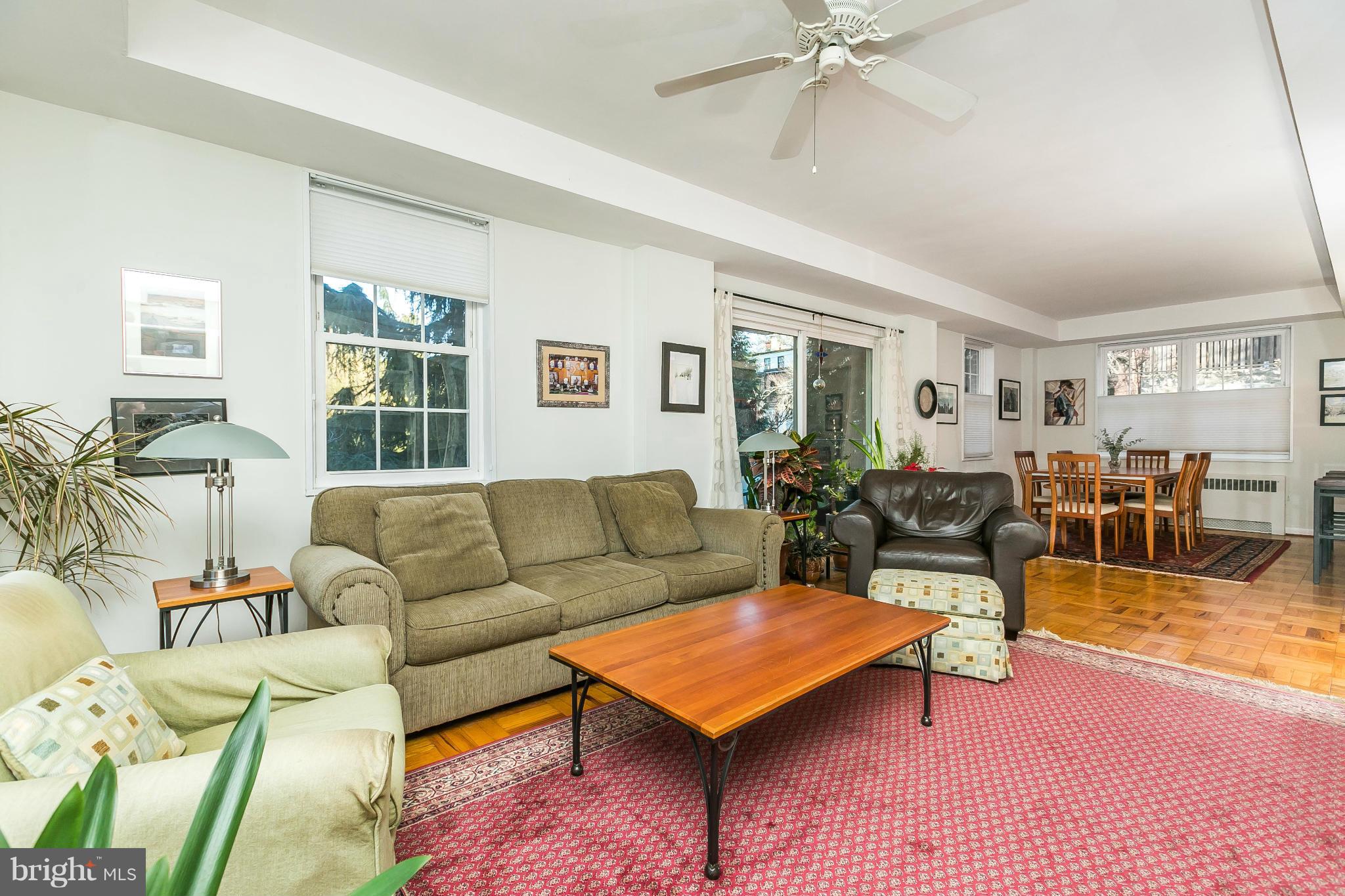 310 Ridgemede Road, Unit 107 Baltimore, MD 21210 - Photo 21 of 28 a living room with furniture a rug and a window