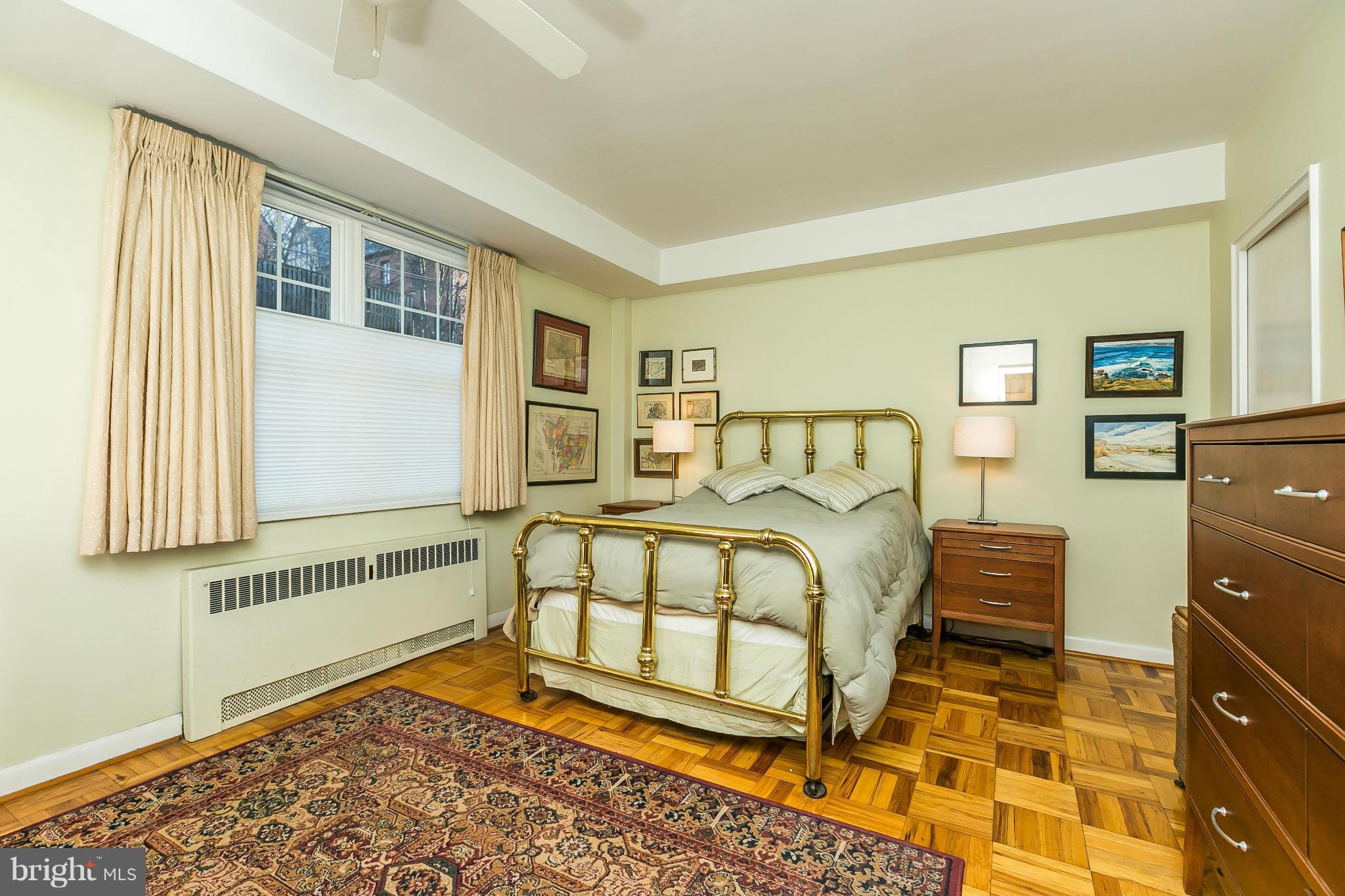 310 Ridgemede Road, Unit 107 Baltimore, MD 21210 - Photo 22 of 28 a bedroom with a bed and a window