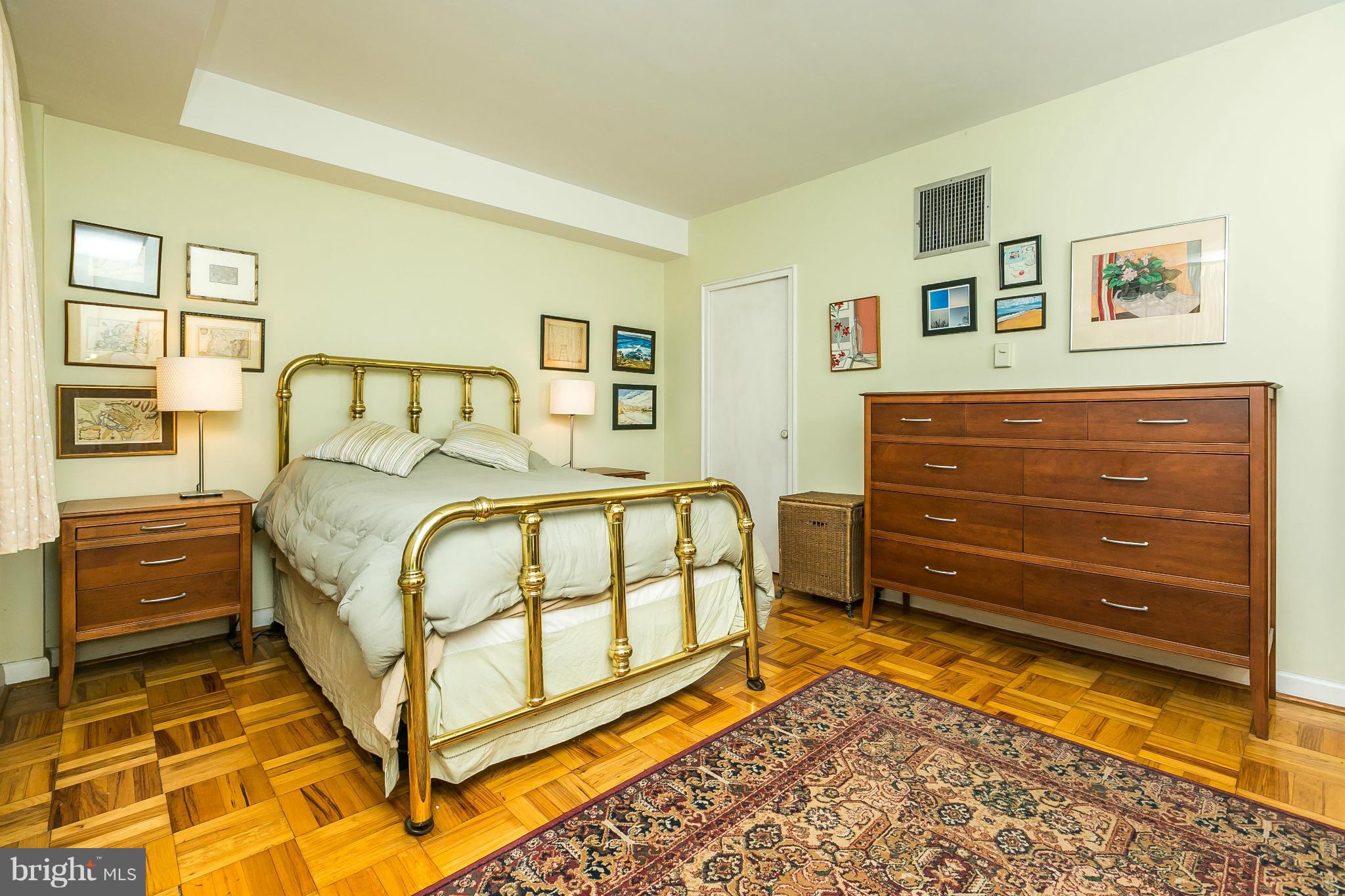 310 Ridgemede Road, Unit 107 Baltimore, MD 21210 - Photo 23 of 28 a bedroom with a bed and a window
