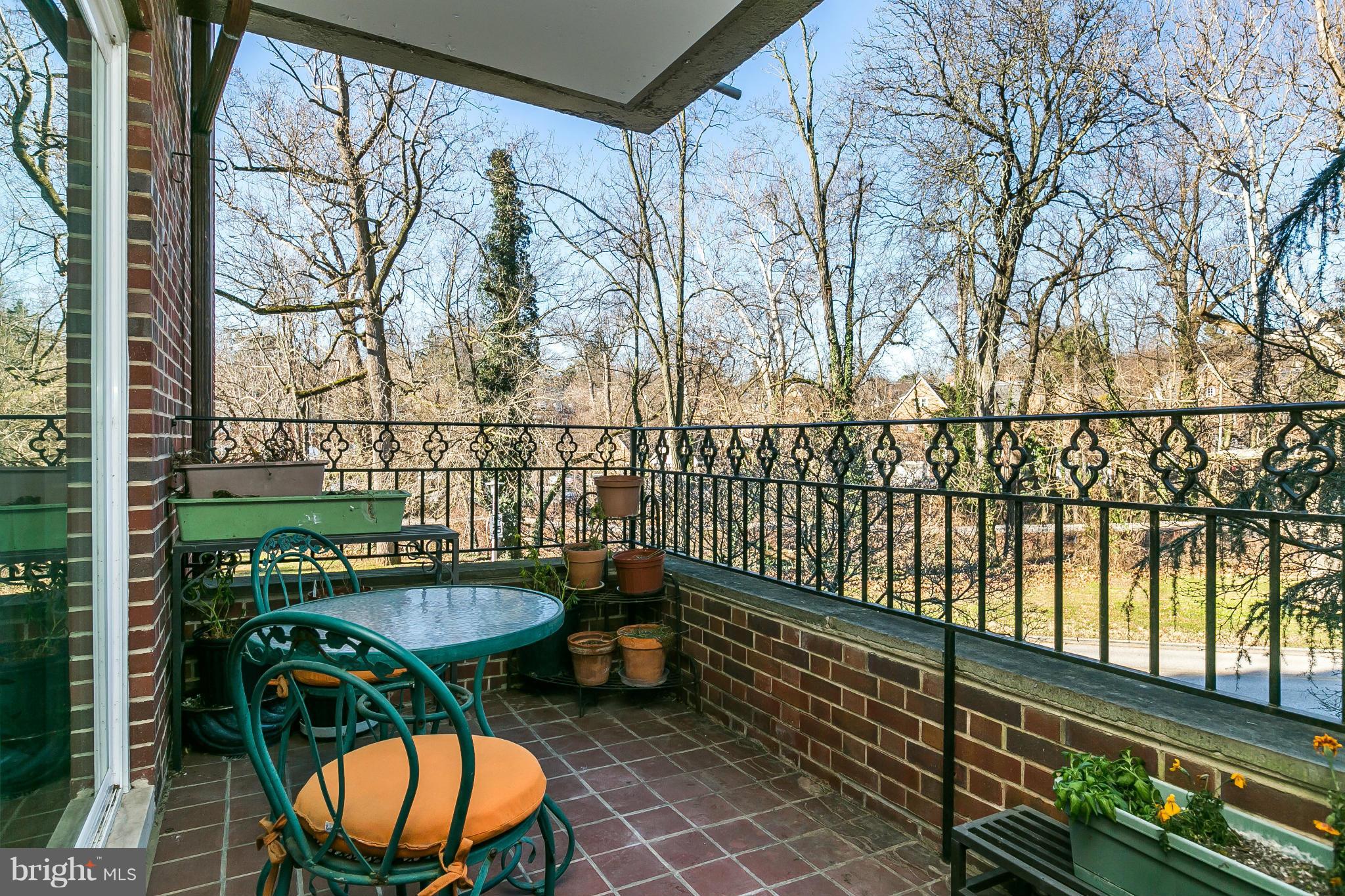 310 Ridgemede Road, Unit 107 Baltimore, MD 21210 - Photo 27 of 28 a view of a chairs and table in the balcony
