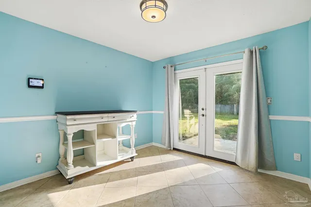 a view of an empty room with glass door