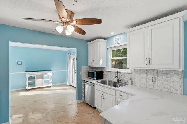 a kitchen with cabinets a window and a sink