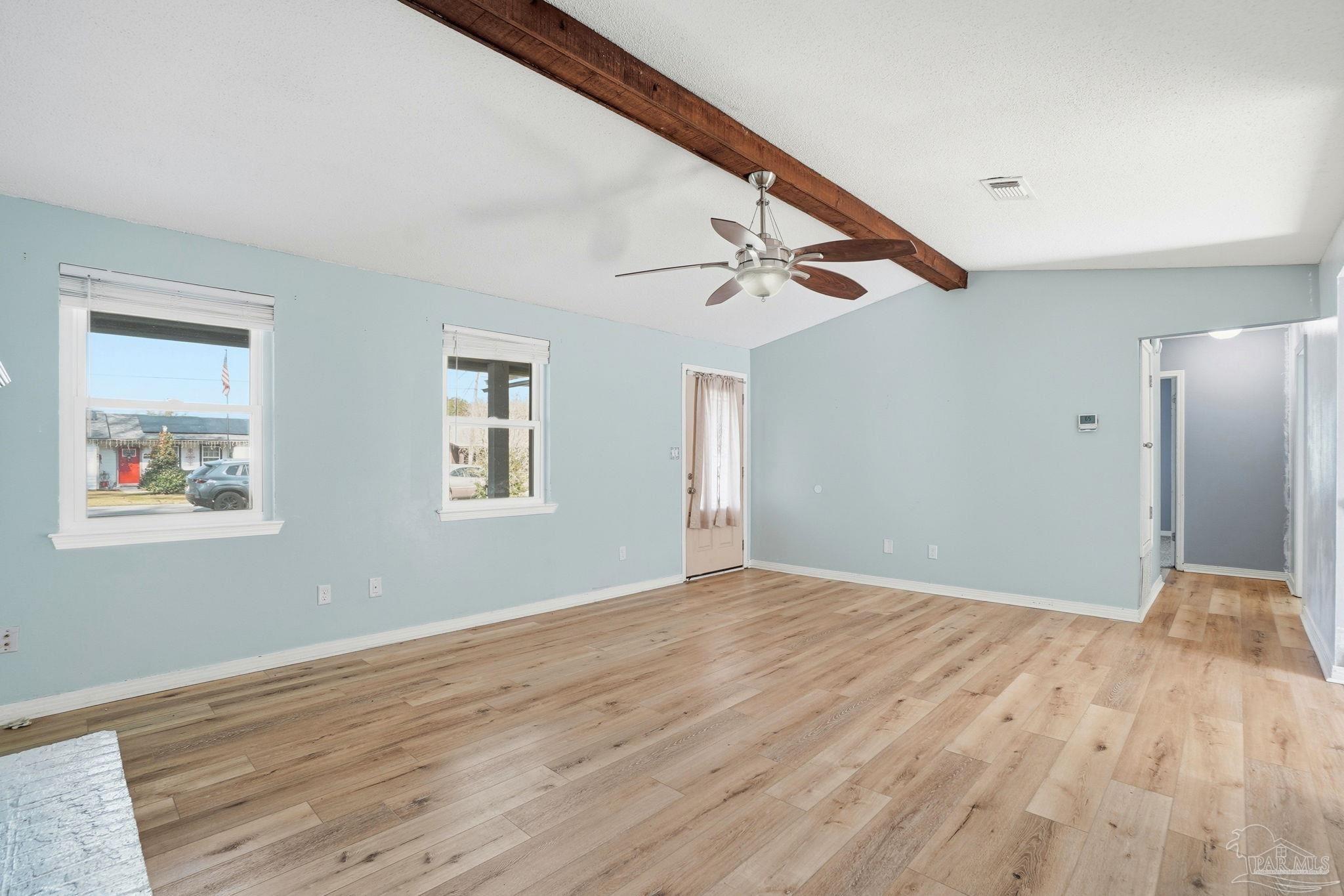 4605 Heatherwood Way Pace, FL 32571 - Photo 31 of 37 a view of an empty room with wooden floor and a window