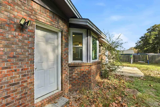 a view of house with yard